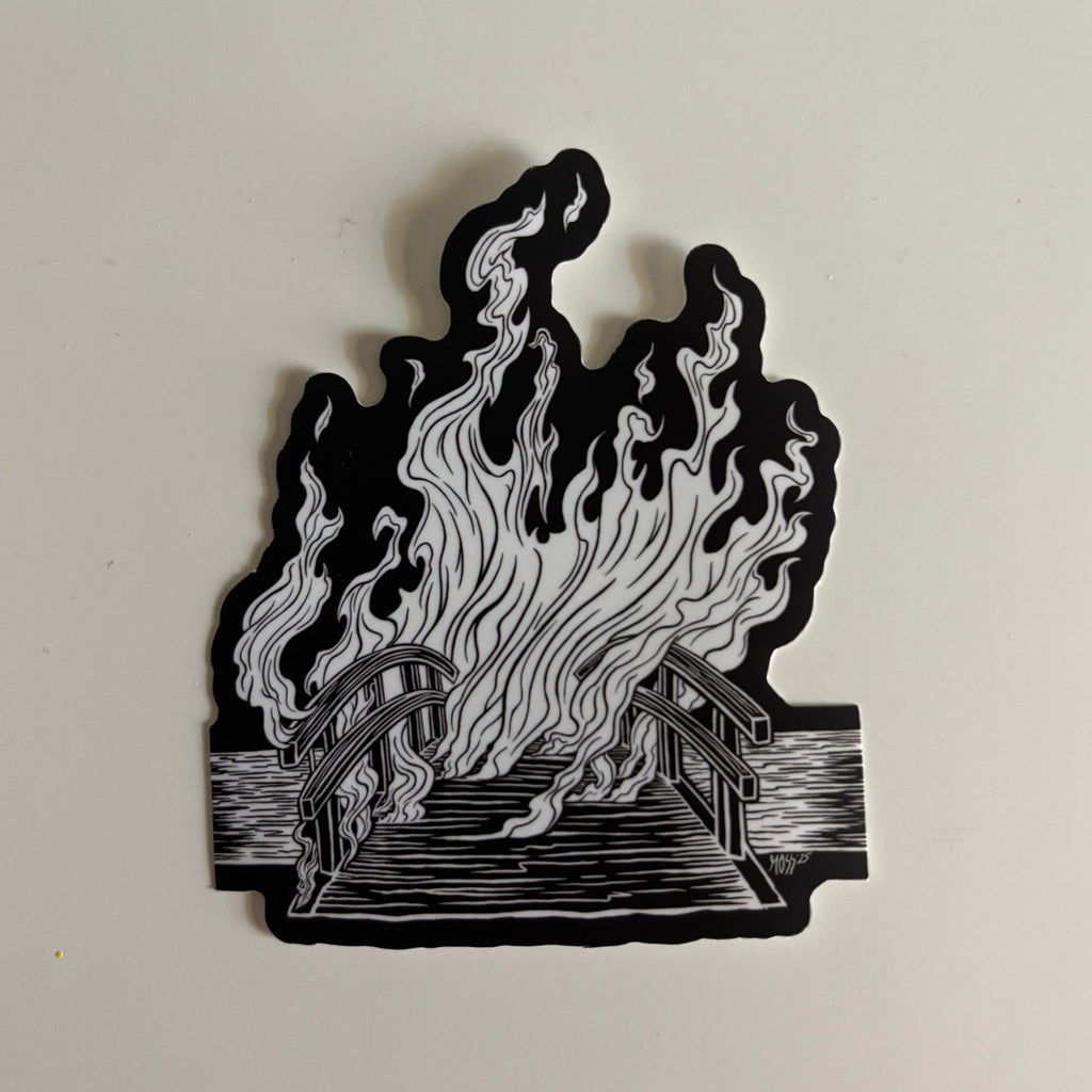 black and white sticker showing a burning bridge