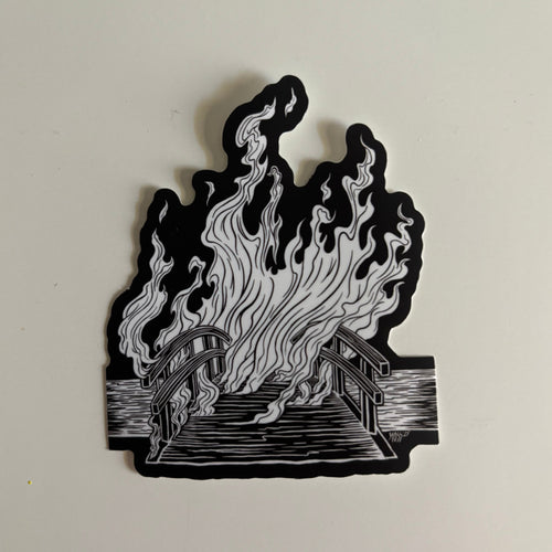 black and white sticker showing a burning bridge