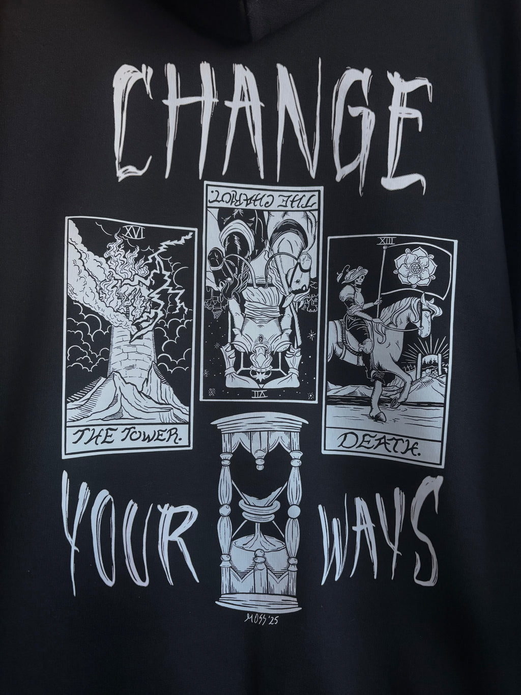 a closeup of the Change Your Ways tarot inspired design printed across the back of a black hoodie