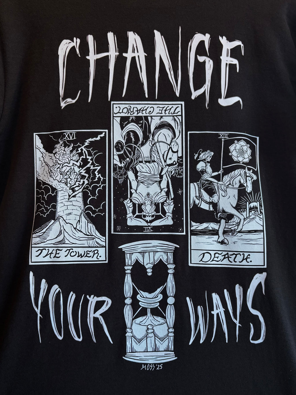 a closeup of the Change Your Ways tarot inspired design printed across the back of a black t-shirt