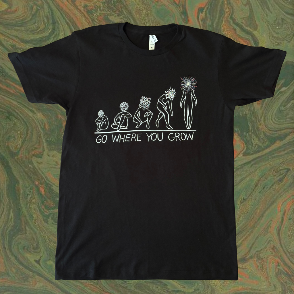 black t-shirt showing the evolution of a soul as it transforms into a Star Child, with the text 'GO WHERE YOU GROW' printed across the chest