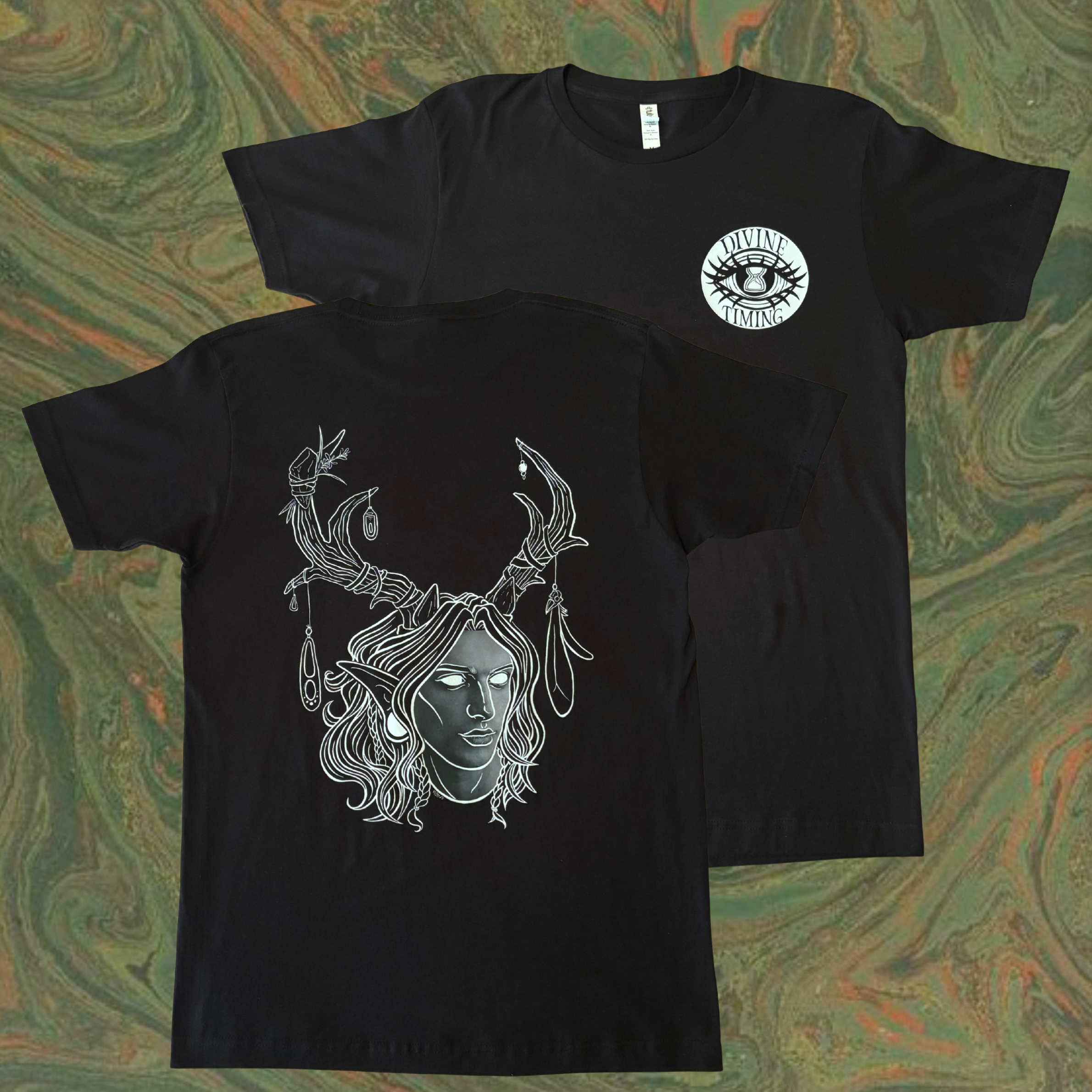 black t-shirt showing the King of the Forest, a Celtic inspired fae lord, printed across the back and the Divine Timing Hourglass Eye as a club patch on the front