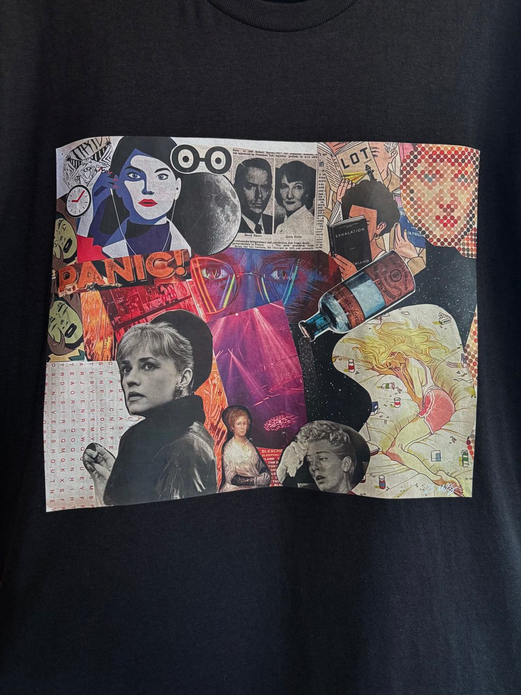 closeup image of the PANIC collage printed on a black tee